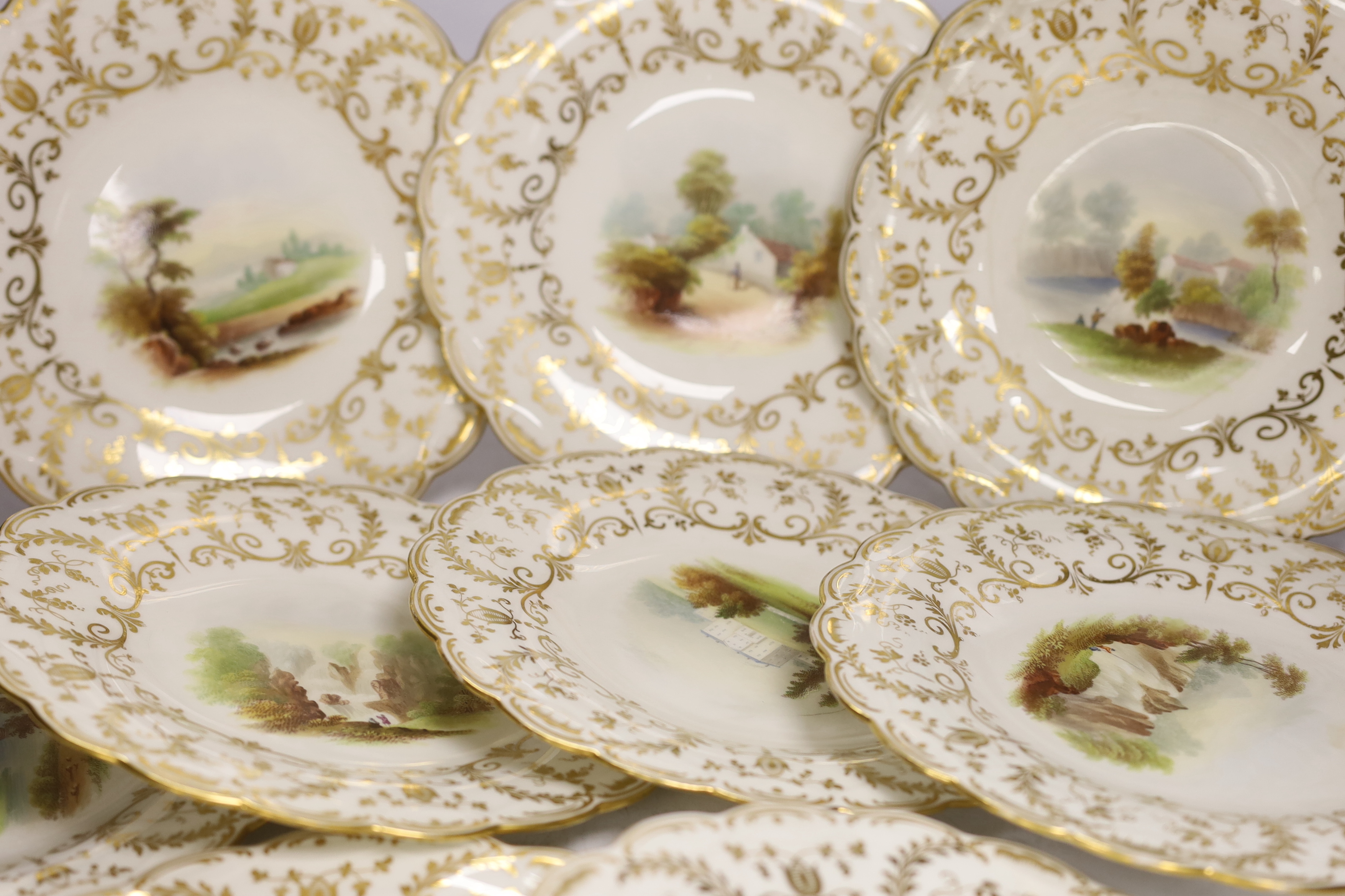 A Minton porcelain landscape painted dessert service, c.1850